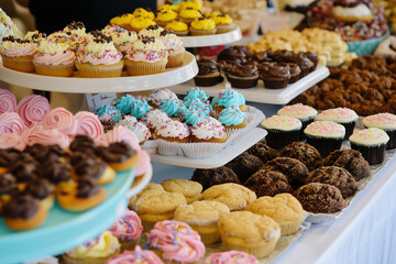 8K real photo of a colorful fundraiser bake sale table featuring a variety of delicious homemade treats, including cookies, cupcakes, brownies, muffins, pastries, and cakes, with a blurred background 