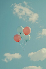 Fototapeta premium Pastel Colored Balloons Floating in the Clear Sky