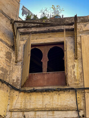Wooden doors agains white-washed homes in Morocco