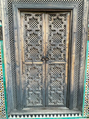 Wooden doors agains white-washed homes in Morocco