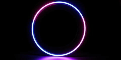 Obraz premium A glowing neon circle with a blue outer ring and a pink inner ring against a black background.