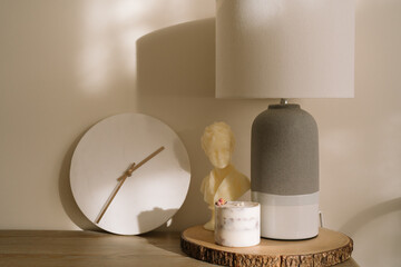 minimalist decor for a living room. A minimalistic sideboard with white marble clock, aesthetic...