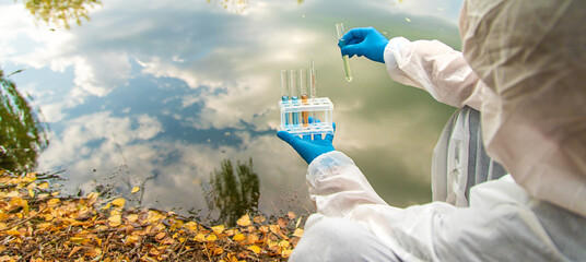 Take water samples for analysis. Selective focus.