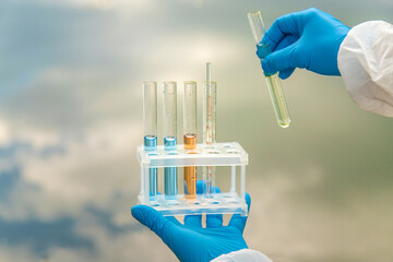Take water samples for analysis. Selective focus.
