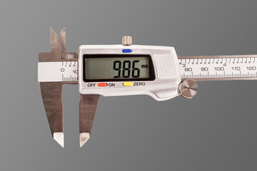 caliper. a device for measuring precision. the size of a part, as well as the diameter. close-up.