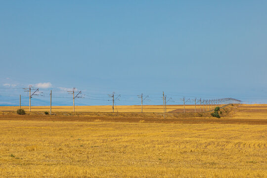 High voltage pylons along the road. Sevan, Armenia.