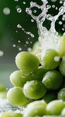 A cluster of fresh, juicy green grapes is dramatically splashed with water droplets, capturing the freshness and vitality of the fruit in high detail.