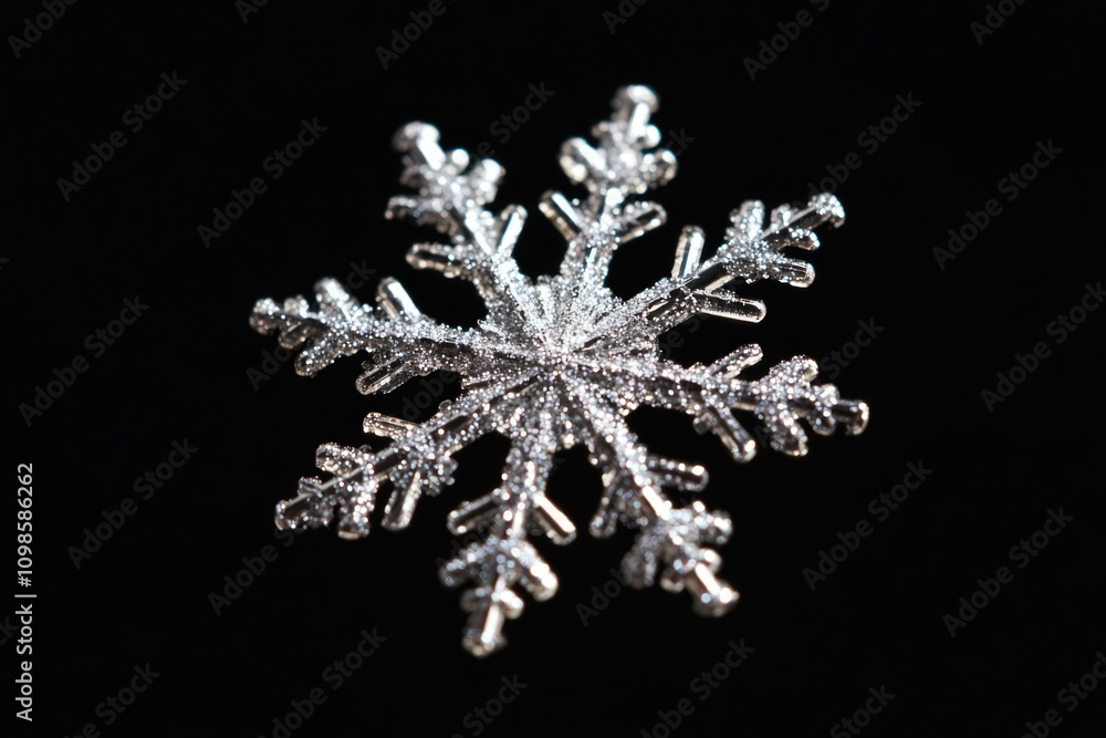 Poster a close-up view of a single snowflake on a dark background