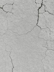 Fototapeta premium Rough gray stony texture with cracks and crevices, outdoor, rough