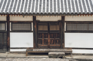 Medeval traditional Japanese architecture. Facade of a house with wooden doors in Nara, Japan.