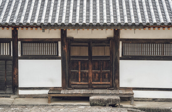 Medeval traditional Japanese architecture. Facade of a house with wooden doors in Nara, Japan.