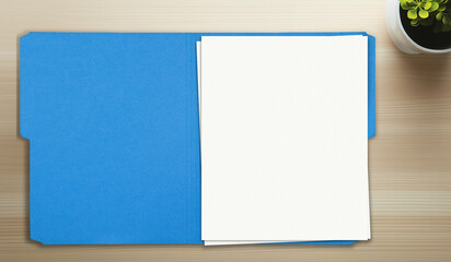 open folder on wood table, blank papers