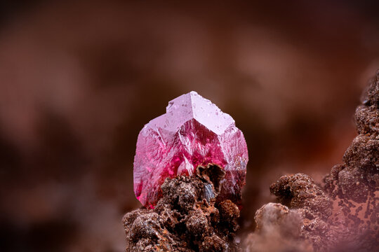 Roselite on goethite. Specimen from Bou Azzer Mine, Amerzgane, Morocco. Micro photography extreme close-up. microscope mineral crystal photography for Scientific use.
