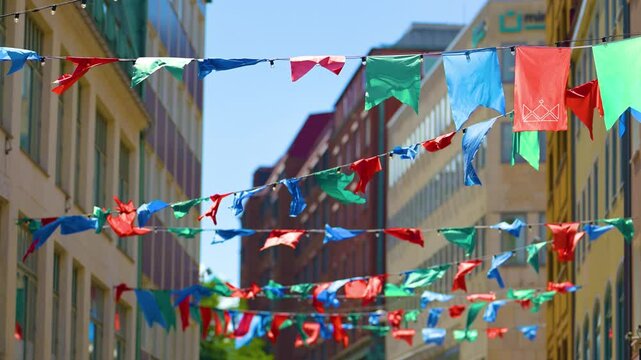 Colourful flags hanging above a shopping street