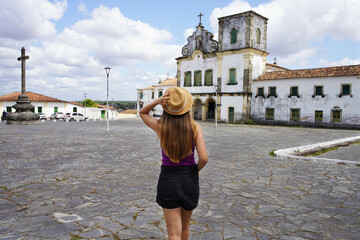 Tourism in Sao Cristovao, Brazil. Young traveler woman visiting Sao Francisco Square in Sao...
