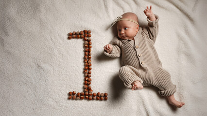 Active European baby full height, one month, pastel colors.