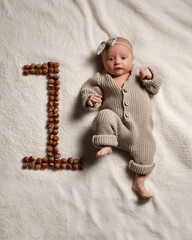 Active European baby full height, one month, pastel colors.