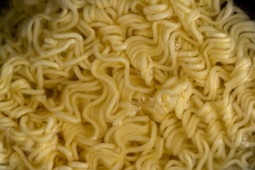 details of flour noodles with eggs during cooking