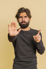 Indian man says No hold palm in stop gesture, warning of finish, prohibited access, declining...