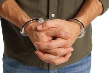 Man in metal handcuffs on white background, closeup