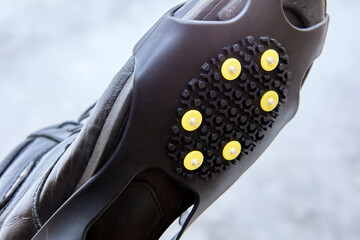 Cleats or crampons that have metal spikes for extra traction on ice, winter walking is safer.