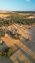 Stunning bird's-eye view of Pinnacles Desert under a vibrant sunset sky in Western Australia