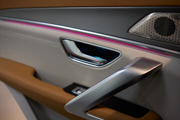 Stylish and Modern Car Interior Design Featuring Carbon Fiber Accents and Ambient Lighting