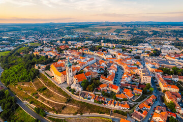 Obraz premium Melnik Castle on the hill above Labe and Vltava River in sunny day. Church with city space and square. Czech Republic.