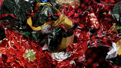 Christmas wrapping paper waste. Used packaging materials for gifts and disposable holiday...