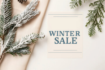 Festive discount banner with a "WINTER SALE" text decorated with frosty  white Christmas tree branches covered in snow