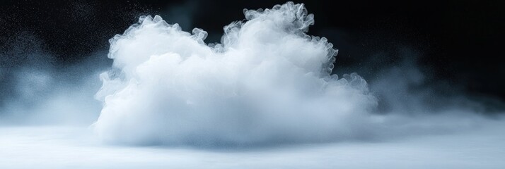 Fototapeta premium A cloud of white smoke is blowing in the air