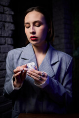 Chic Woman Enjoying Music with Wireless Earbuds in a Contemporary Setting that Inspires