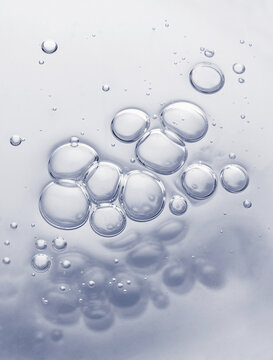 Clear cosmetic gel serum oil bubble texture background Hyaluronic skin care moisturizer product sample with bubbles macro