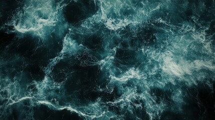 Fototapeta premium Top down aerial view of moody ocean wave