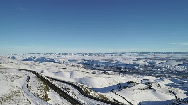 video of Lewiston Idaho and Clarkston Washington covered in a blanket of snow taken from a drone above the Lewiston Hill on US Highway 95