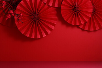 Red paper fans with floral accents on a monochrome red backdrop. Happy Chinese New Year, Lunar New...