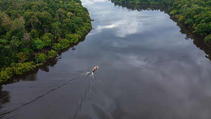 BLACK WATER RIVER IN THE PERUVIAN AMAZON, THE NANAY RIVER IS A LARGE IGAPO SURROUNDED BY LARGE...