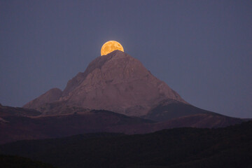 Moonrise. Aftermath of a full moon rising behind the mountain