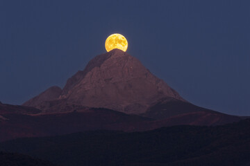 Moonrise. Aftermath of a full moon rising behind the mountain