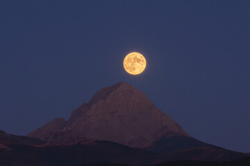 Moonrise. Aftermath of a full moon rising behind the mountain