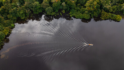 BLACK WATER RIVER IN THE PERUVIAN AMAZON, THE NANAY RIVER IS A LARGE IGAPO SURROUNDED BY LARGE...