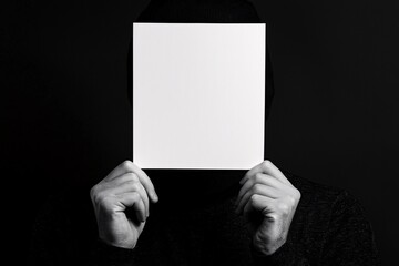 Naklejka premium Anonymous Person Hiding Face Blank Sign Protest Concealment