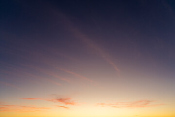 Dark Blue Pink Colorful Sky with Cirrus Clouds at Sunset. Blue Hour. Abstract Texture Background.