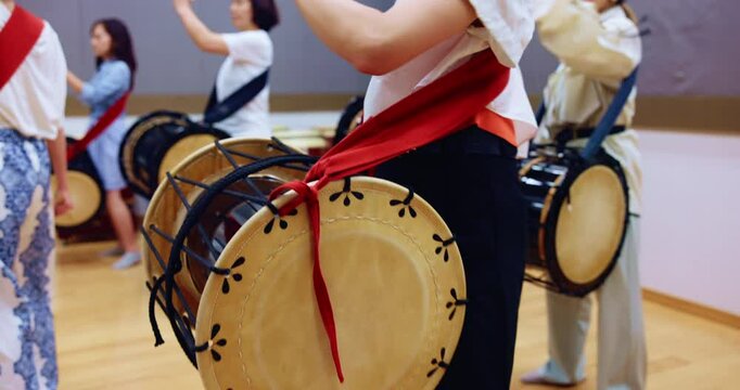 Music, drums and instrument with musician hand in studio for class, performance or practice. Traditional Japanese art, taiko band and sound with bachi, demonstration or talent for percussion teaching