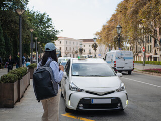 Urban scene with person and taxi in city street environment