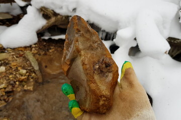 Flint in the form of a large stone axe found in a stream, an archaeological artifact of the Stone...
