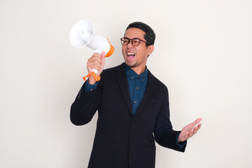 A man wearing suit showing excited expression when talking using megaphone