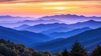 Fototapeta premium Layered mountains bathed in golden sunrise hues creating a breathtaking landscape ideal for travel brochures, covers, or captivating wallpapers.