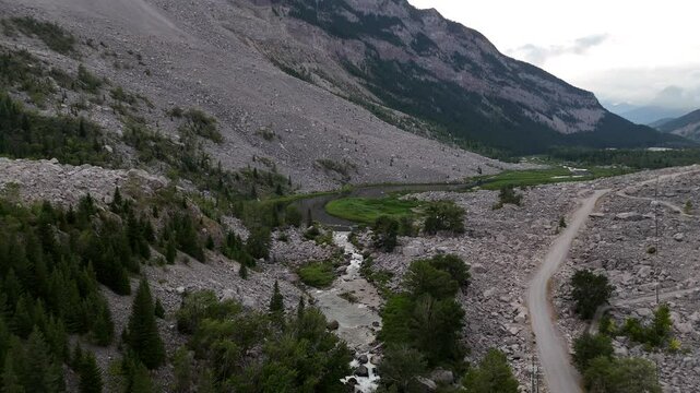 Crowsnest Pass aerial video overlooking the Frank Slide tourist attraction and fly fishing destination rivers of the world in Alberta Canada.
