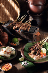 Sate ayam or chicken satay is Indonesian food and cuisine of seasoned, skewered and grilled chicken...